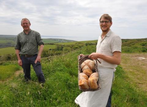Tony Little and Rupert Dunn Outdoors with bread
